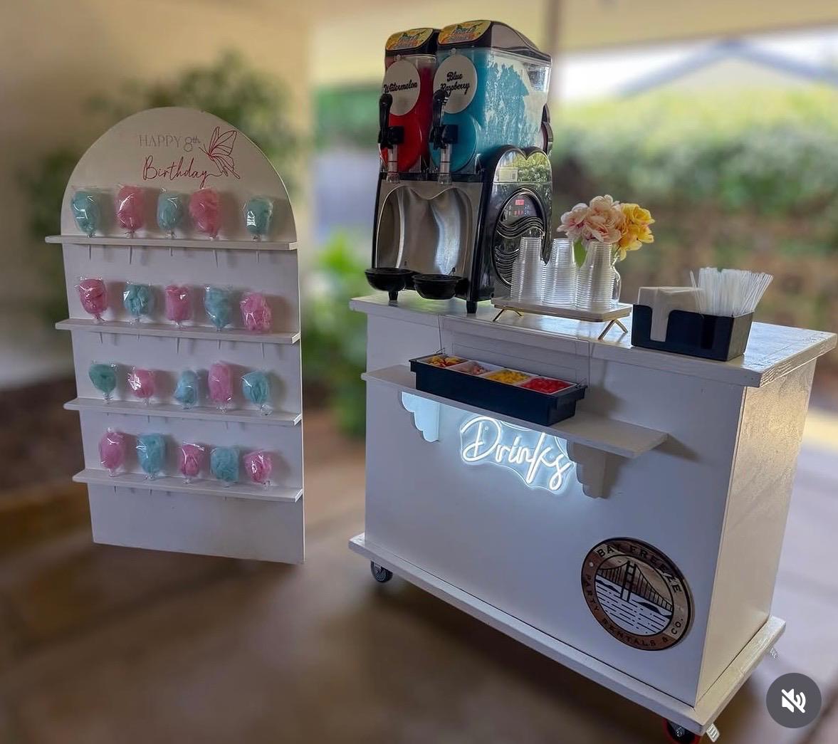 Oscar's cart and arched display styled with cotton candy and slushies at an 8th birthday party