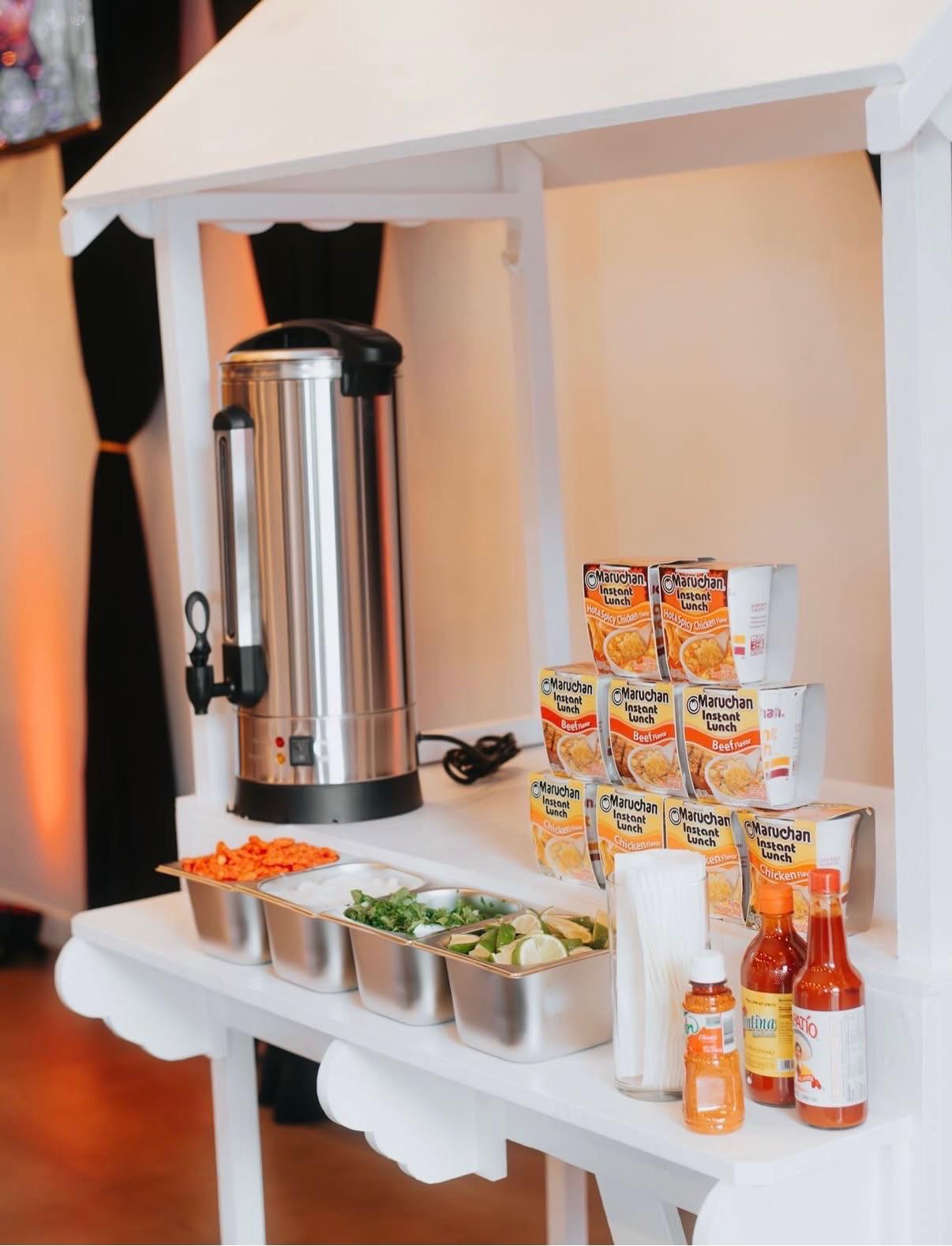 Cart set up as an instant ramen and hot food bar