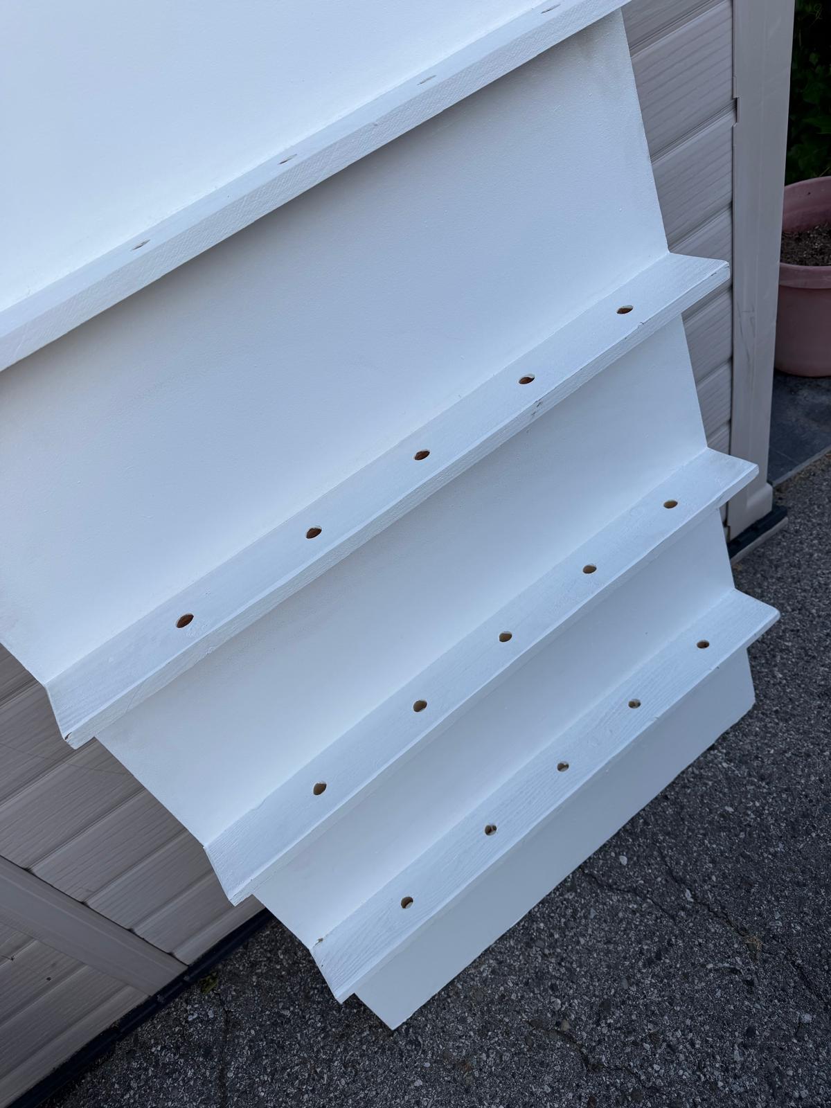 Tiered stepped wooden display shelf with peg-holes